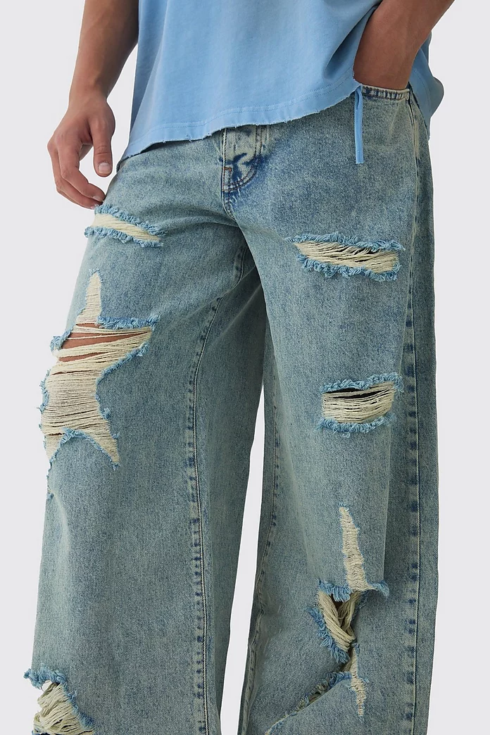 Baggy Fit Rigid Star Ripped Jeans | boohooMAN USA Baggy Fit Rigid Star Ripped Jeans | boohooMAN USA
